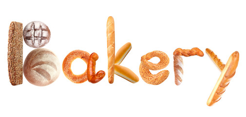 Word BAKERY made of fresh bread on white background