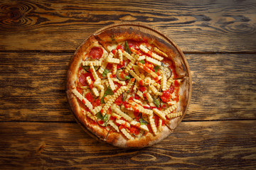 Tasty pizza on wooden table