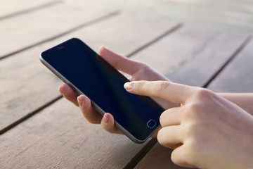 The girl is holding a phone