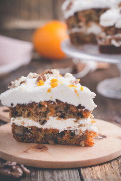 Carrot  cake with cinnamon,  walnuts and orange cream cheese frosting