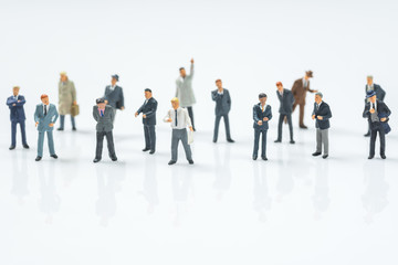 crowd of business miniature people on white background - obrazy, fototapety, plakaty