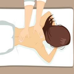 Obraz premium Young attractive woman having a massage on her back at spa