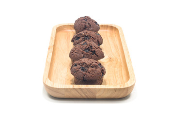 Muffins chocolate on wood with white background.
