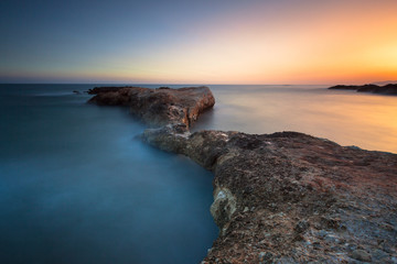 Beautiful long exposure seascape with sunrise or sunset.