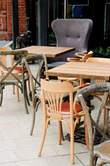 Chairs and tables on summer terrace on outdoor cafe