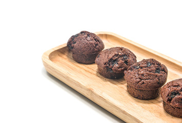 Muffins chocolate on wood with white background.