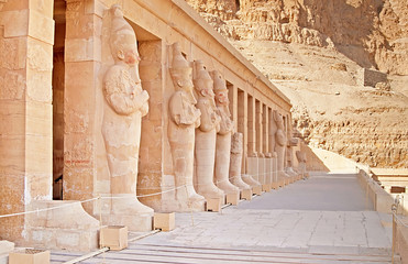 Statues on facade of palace of Hatshepsut in Luxor, Egypt