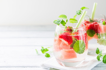 Cold drink with watermelon, strawberry, balm mint. Copy space