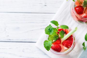 Drink with watermelon, strawberry, balm mint. Top view, copy space