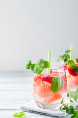 Cold drink with watermelon, strawberry, balm mint. Copy space