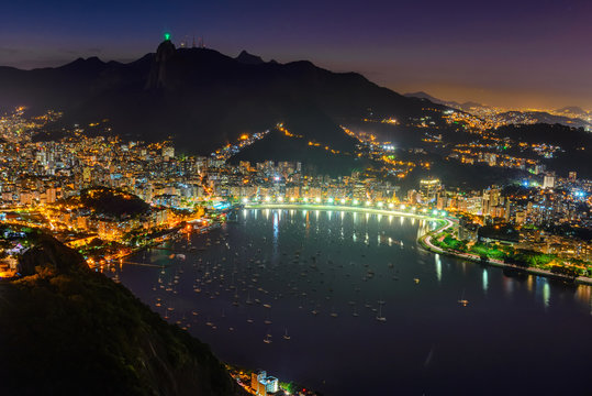 Night view of Corcovado, Botafogo, and Guanabara bay in Rio de Janeiro. Brazil
