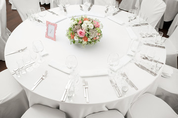 table setting, festive round tables ready for guests.