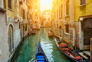 Fototapeta na wymiar Canal with gondolas in Venice, Italy