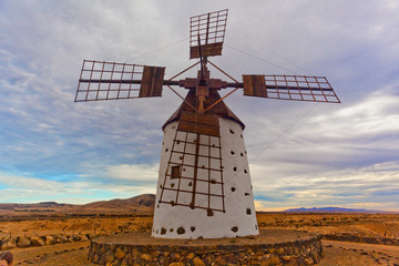 Old Windmill on Rocky Desert