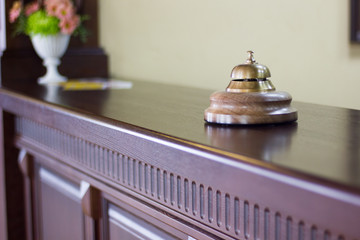 Service bell in a hotel reception for concierge alarm on desk.