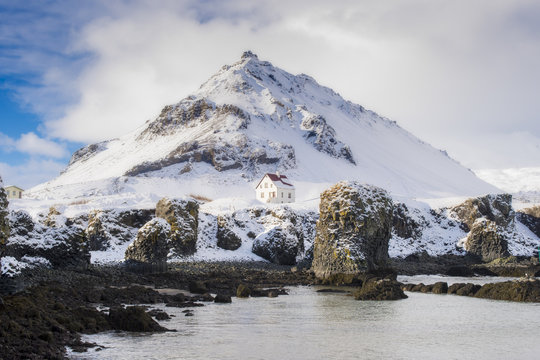 Lonely house on coast in winter, Arnarstapi, Snaefellsnes Peninsula, Iceland
