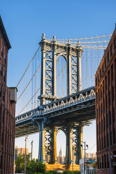 The Manhattan bridge with the Empire state building framed in the bridge, New York, USA