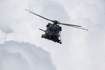 Fototapeta na wymiar Modern tactical helicopter flying towards the camera.