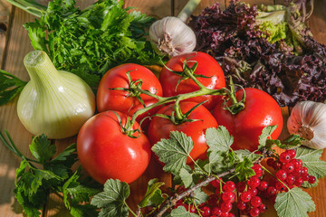 A variety of vegetables lying on a wooden Board. The ingredients for the salad on the table.