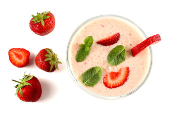 Healthy strawberry yogurt with mint leaves and fresh berries isolated on white background. Top view.