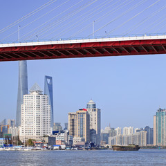 Bridge over Huangpu River with skyline on the background, Shanghai, China