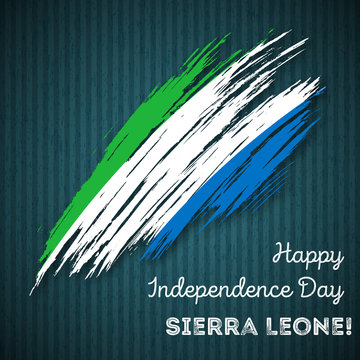 Sierra Leone Independence Day Patriotic Design. Expressive Brush Stroke in National Flag Colors on dark striped background. Happy Independence Day Sierra Leone Vector Greeting Card.