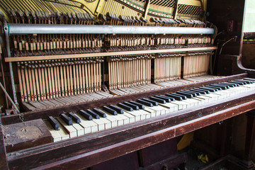 Keys from an old broken damaged piano