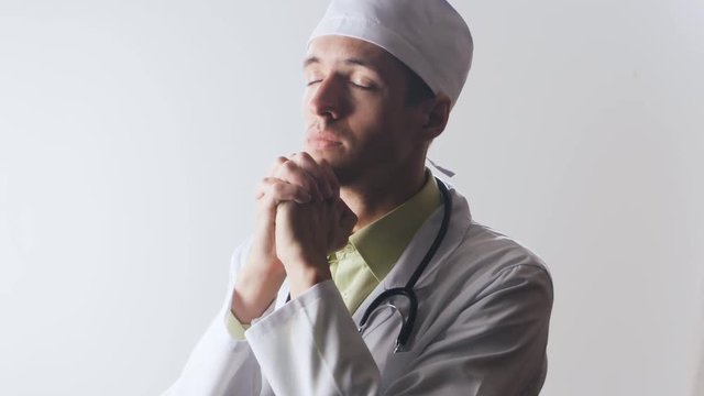 The doctor prays to the god. Powerlessness of medicine. Religion and medicine.