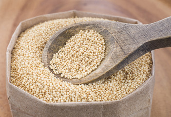 Amaranth seeds in wooden spoon (Amaranthus)