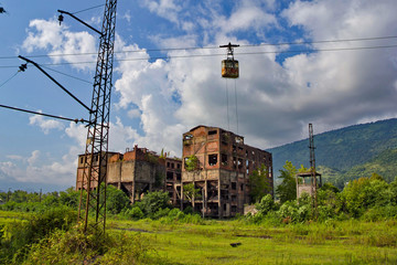 Abandoned train station, factory and cable car in Tquarchal (Tkvarcheli). Abkhazia, Georgia