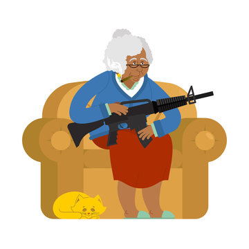 African American Grandmother With Gun. Old Woman In An Armchair With Tommy Gun And Cat. Grandma With Rifle. Protection Of Pensioners