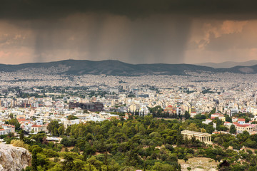 Fototapeta na wymiar Rain falling over Athens, Greece; high angle view