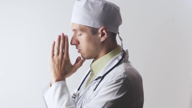 The doctor prays to the god. Powerlessness of medicine. Religion and medicine.