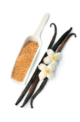 Vanilla sugar and sticks with flowers .