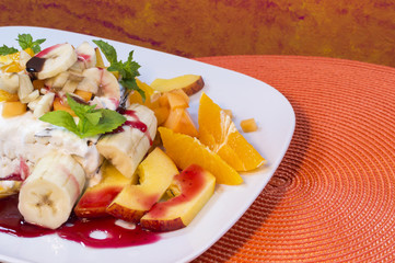 A chocolate and cream ice cream with fruits