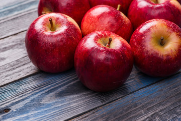 Seasonal. Autumn. Red apples on the rustic wooden surface
