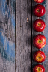 Seasonal. Autumn. Red apples on the rustic wooden surface