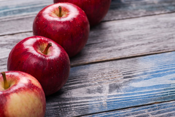 Seasonal. Autumn. Red apples on the rustic wooden surface