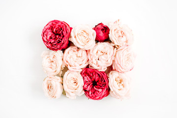 Red and beige rose buds bouquet on white background. Flat lay, top view.