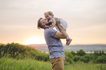 Beautiful portrait of young attractive father with daughter toddler