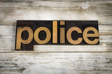 Police Letterpress Word on Wooden Background