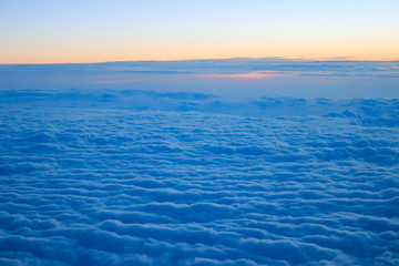 Photo of cloudy sunrise seen from above