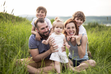 Happy family in the meadow