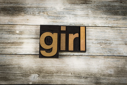 Girl Letterpress Word on Wooden Background