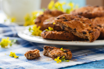 Homemade oatmeal cookies folded in a pile on the old table