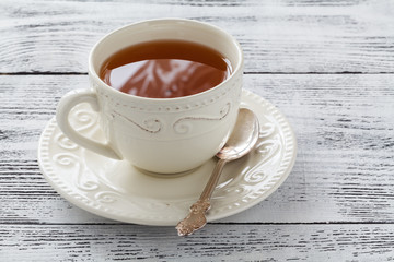 Hot tea in old cup