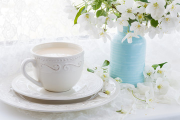 Obraz na płótnie Canvas Tea service in the garden. Cups of tea and tea pot. Drinking tea in the garden