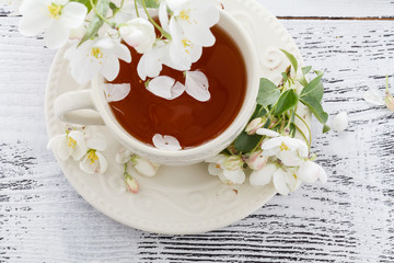 Romantic tea in the blossoming garden