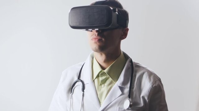 Doctor uses a virtual reality glasses.
