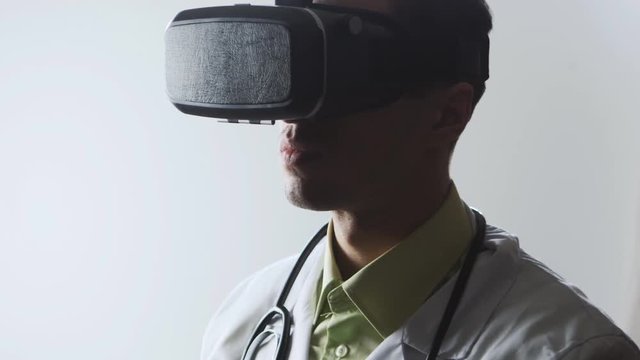 Doctor uses a virtual reality glasses.